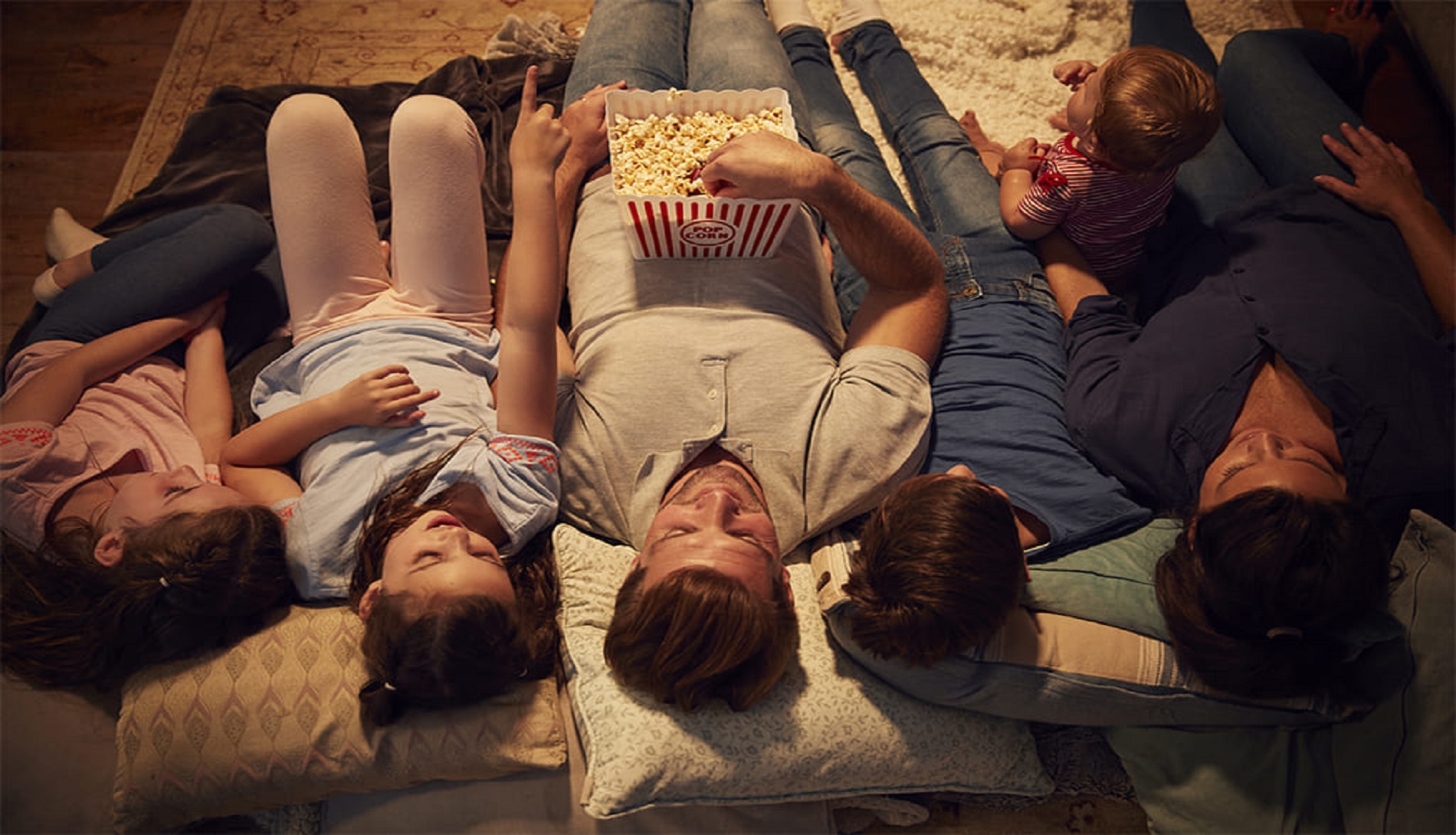 Family watching TV from above