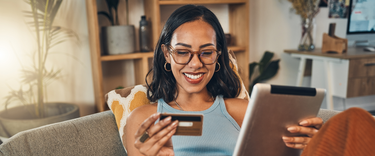 How to make your credit card work for you woman checking finances with credit card Person using a credit card
